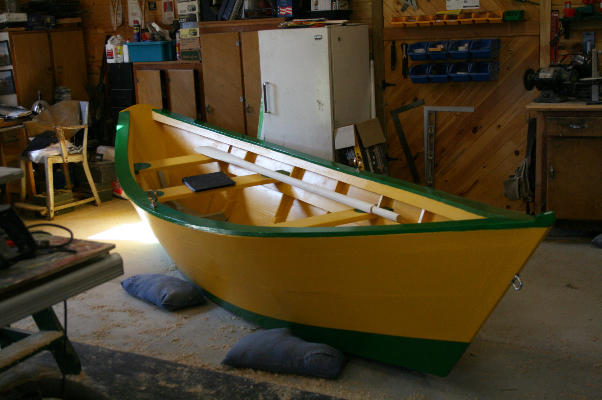 Freshly painted Grand Banks dory in a home workshop