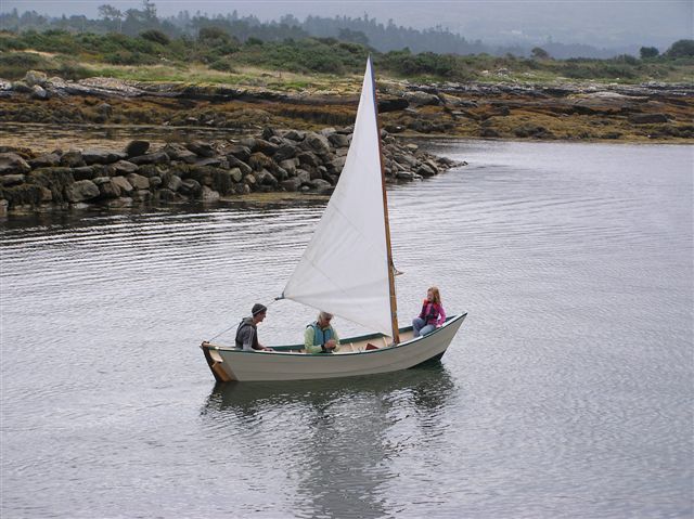 Customer-built Grand Banks dory under sail on open water