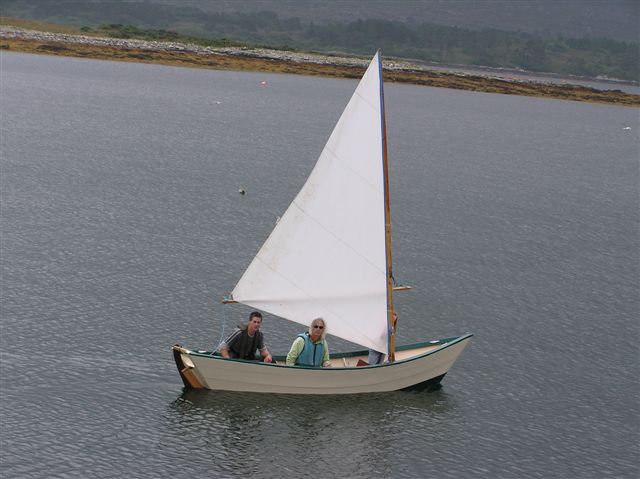 Customer-built Grand Banks dory sailing, view from stern