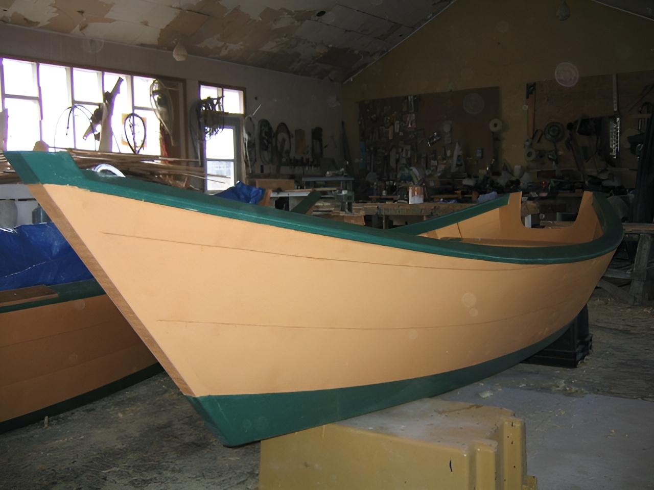 Completed Grand Banks dory finished and ready in a home workshop
