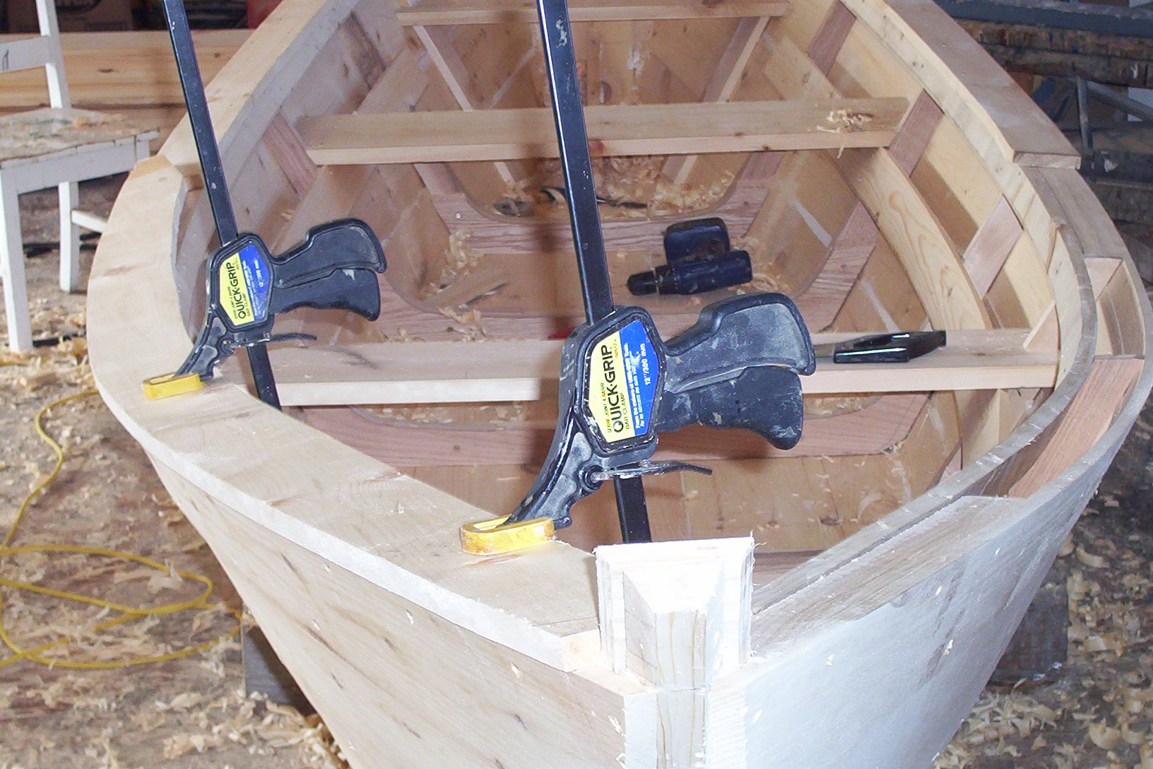 Dory hull under construction  -  planks clamped and taking shape