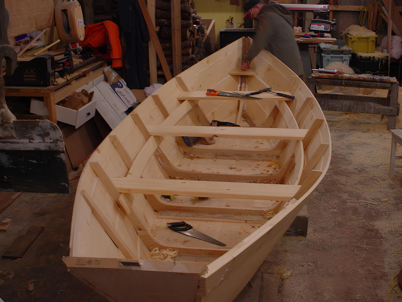 Grand Banks dory frame under construction in a workshop - traditional timber planking method