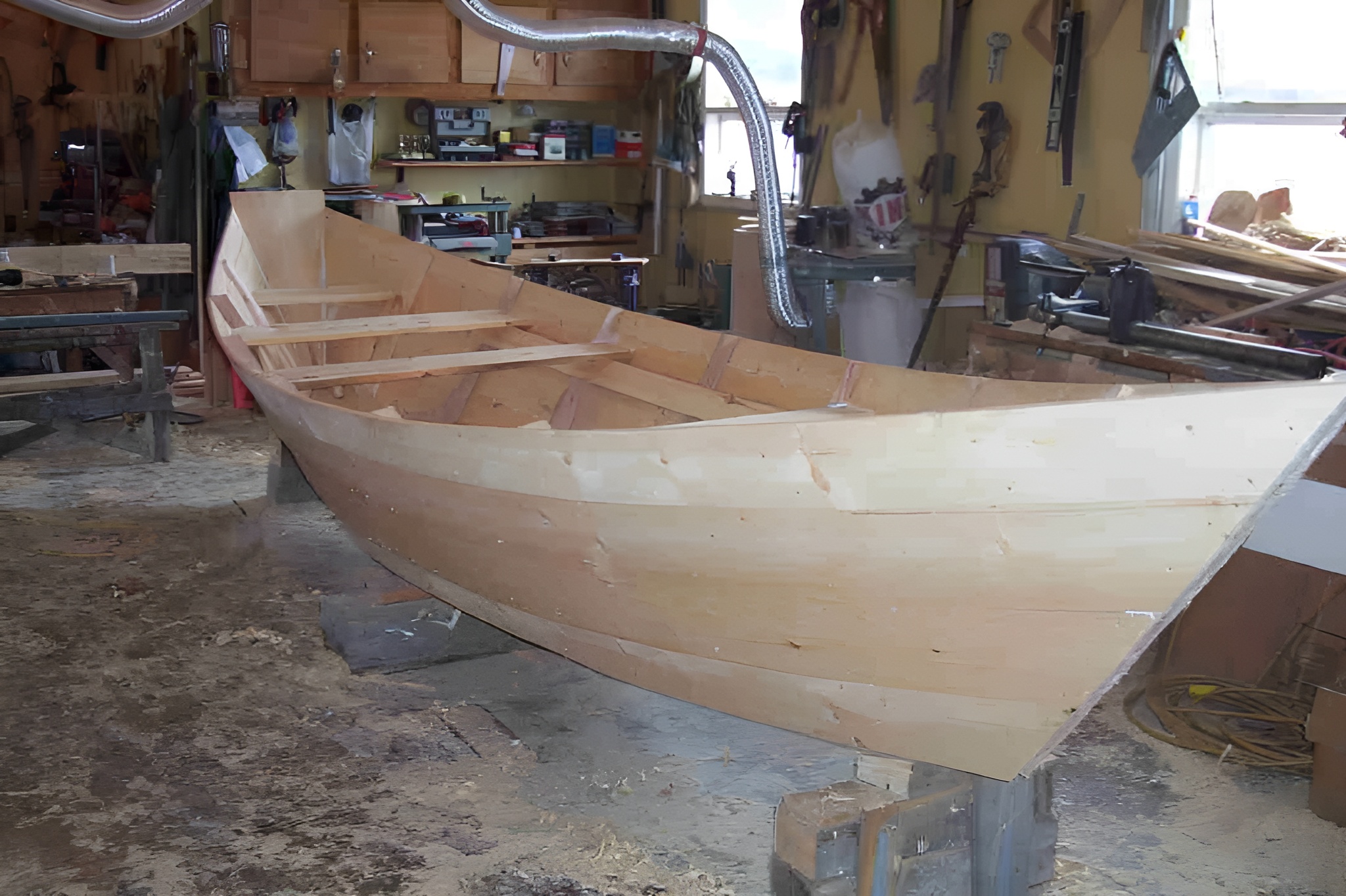 Dory planking in progress - fitting boards to the frames